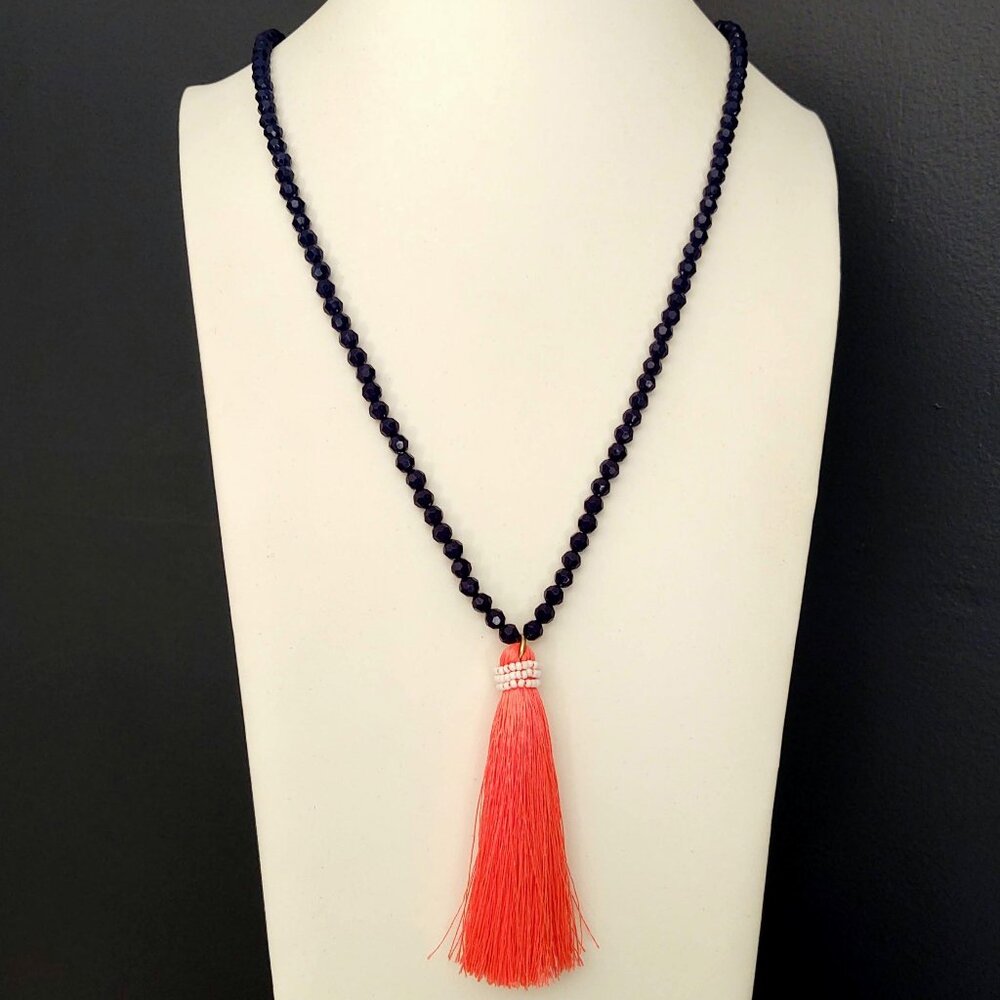 Navy beaded necklace with florescent orange thread tassel